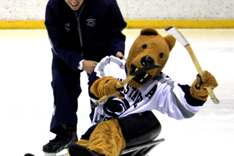 <p>
	Alex Trier and The Nittany Lion Takes a Sled for a Ride</p>
